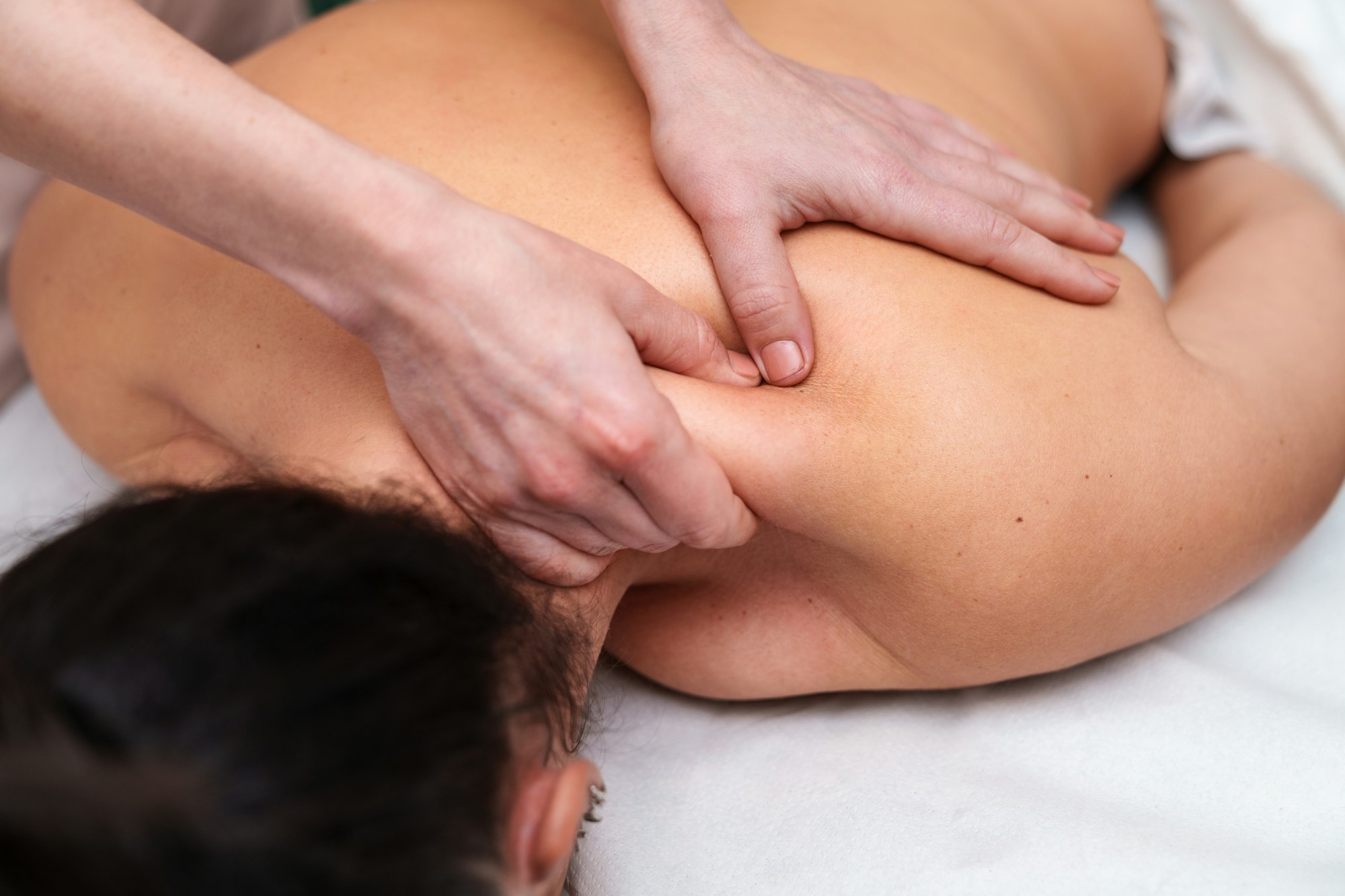 Deep Tissue Massage on Female Client by a Professional Therapist